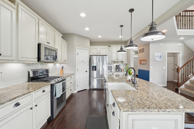 574 Ravensridge Ct, Alexandria, KY 41001 - kitchen featuring stainless steel appliances, tasteful backsplash, an island with sink, dark wood finished floors, and recessed lighting