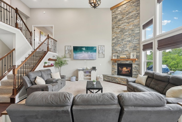 574 Ravensridge Ct, Alexandria, KY 41001 - living area featuring a high ceiling, a fireplace, and stairs