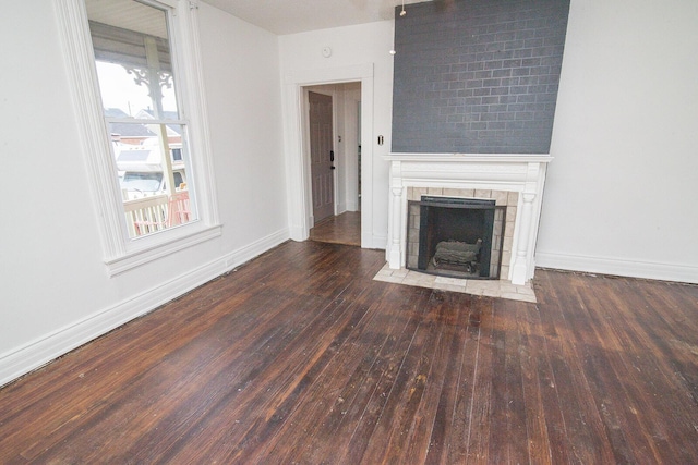 3213 Decoursey Ave, Covington, KY 41015 - unfurnished living room with hardwood / wood-style floors, baseboards, and a fireplace