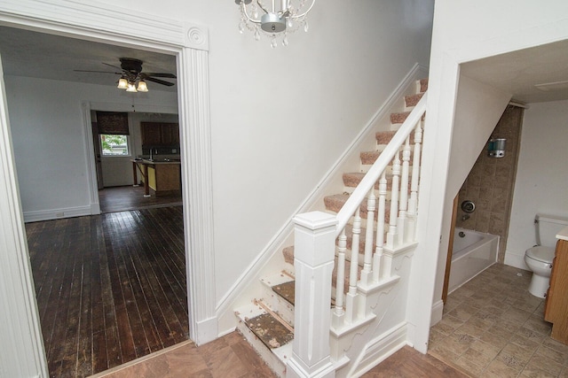 3213 Decoursey Ave, Covington, KY 41015 - stairs with a chandelier and a ceiling fan