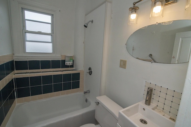 3213 Decoursey Ave, Covington, KY 41015 - bathroom featuring toilet, a sink, decorative backsplash, and  shower combination