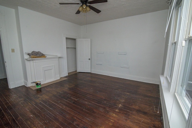 3213 Decoursey Ave, Covington, KY 41015 - unfurnished bedroom featuring hardwood / wood-style flooring, baseboards, a ceiling fan, and a textured ceiling