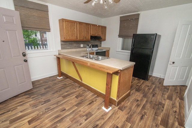 3213 Decoursey Ave, Covington, KY 41015 - kitchen featuring freestanding refrigerator, a sink, light countertops, dark wood-style flooring, and a textured ceiling