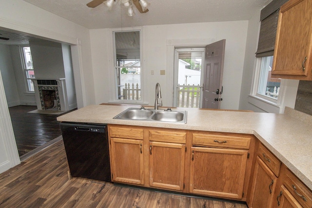 3213 Decoursey Ave, Covington, KY 41015 - kitchen with dishwasher, a sink, dark wood-type flooring, and light countertops