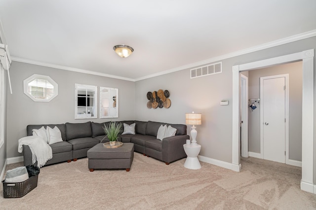 living room featuring carpet floors, ornamental molding, and baseboards
