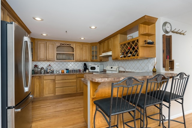 335 Fernwood Dr, Williamstown, KY 41097 - kitchen with freestanding refrigerator, open shelves, a peninsula, light wood-style flooring, and tasteful backsplash