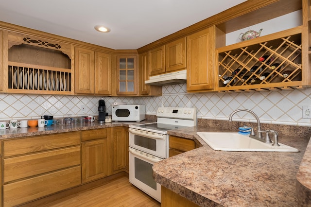 335 Fernwood Dr, Williamstown, KY 41097 - kitchen featuring white appliances, under cabinet range hood, open shelves, a sink, and glass insert cabinets