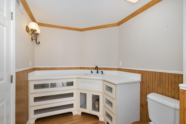 335 Fernwood Dr, Williamstown, KY 41097 - bathroom featuring wainscoting, toilet, ornamental molding, vanity, and wood walls