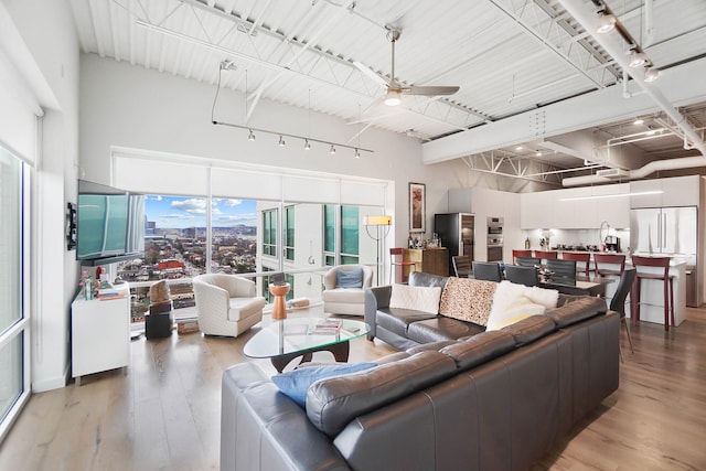 120 Main St Unit 306, Newport, KY 41071 - living room featuring light wood-style flooring and ceiling fan