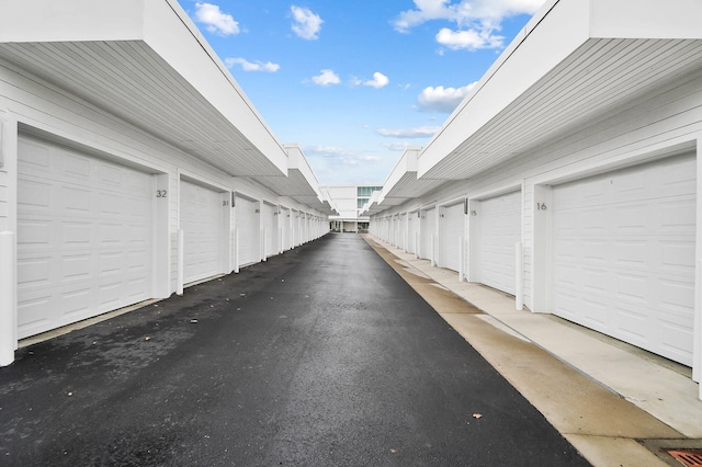 120 Main St Unit 306, Newport, KY 41071 - view of asphalt alley featuring community garages