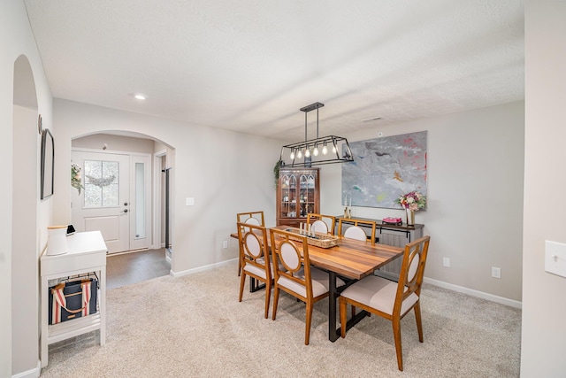 2263 Piazza Rdg, Covington, KY 41017 - dining room featuring arched walkways, light carpet, baseboards, recessed lighting, and a chandelier