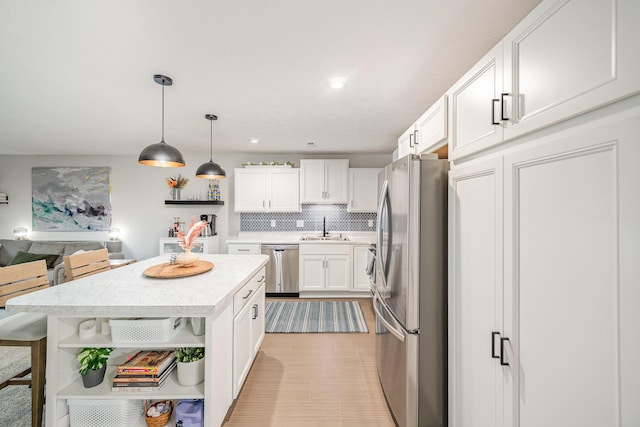 2263 Piazza Rdg, Covington, KY 41017 - kitchen with open shelves, stainless steel appliances, a sink, white cabinetry, and light countertops