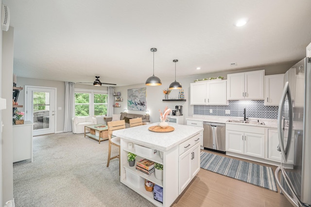 2263 Piazza Rdg, Covington, KY 41017 - kitchen featuring stainless steel appliances, a sink, white cabinets, light countertops, and recessed lighting