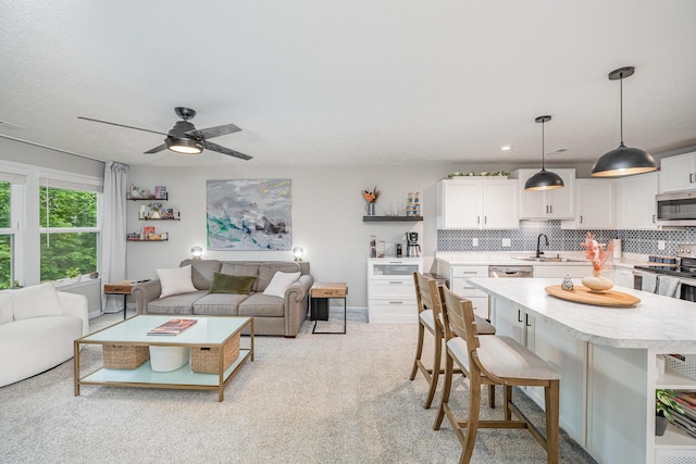 2263 Piazza Rdg, Covington, KY 41017 - living room with ceiling fan, baseboards, and light colored carpet
