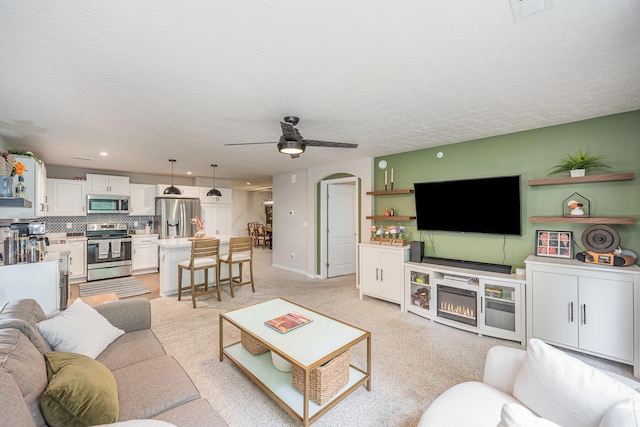 2263 Piazza Rdg, Covington, KY 41017 - living room featuring a ceiling fan, light carpet, arched walkways, recessed lighting, and a textured ceiling