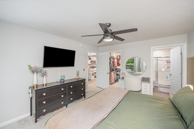 2263 Piazza Rdg, Covington, KY 41017 - bedroom featuring a walk in closet, a closet, light carpet, baseboards, and ceiling fan