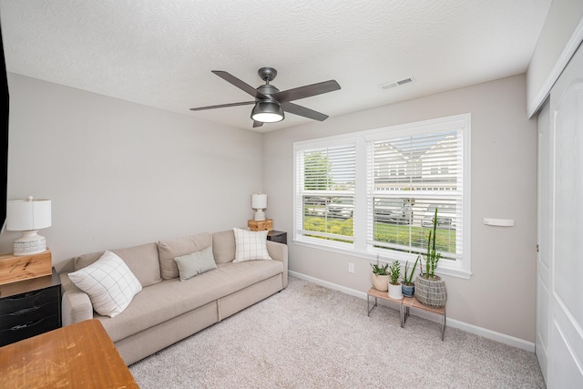 2263 Piazza Rdg, Covington, KY 41017 - carpeted living area featuring a ceiling fan, baseboards, and a textured ceiling