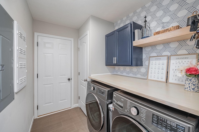 2263 Piazza Rdg, Covington, KY 41017 - laundry area featuring cabinet space, independent washer and dryer, baseboards, and wood finished floors