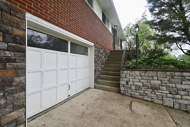 529 Stevenson Rd, Erlanger, KY 41018 - view of property exterior featuring stone siding, brick siding, and stairway