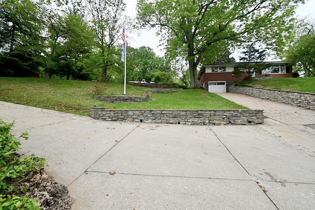 529 Stevenson Rd, Erlanger, KY 41018 - view of green lawn with concrete driveway and a garage