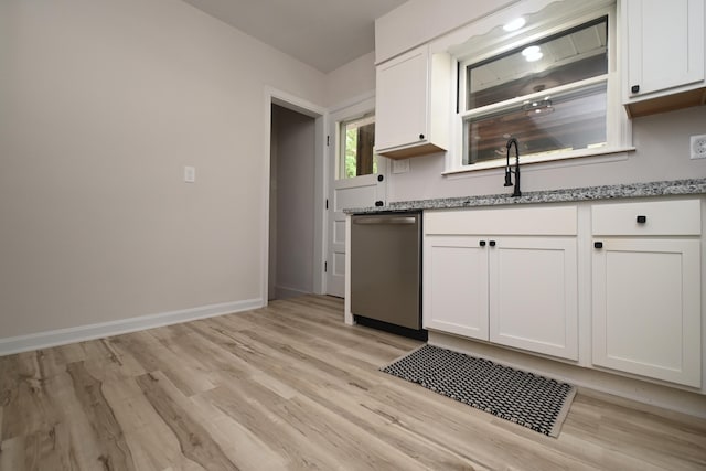 529 Stevenson Rd, Erlanger, KY 41018 - kitchen featuring stainless steel dishwasher, white cabinetry, light stone counters, and light wood-style floors
