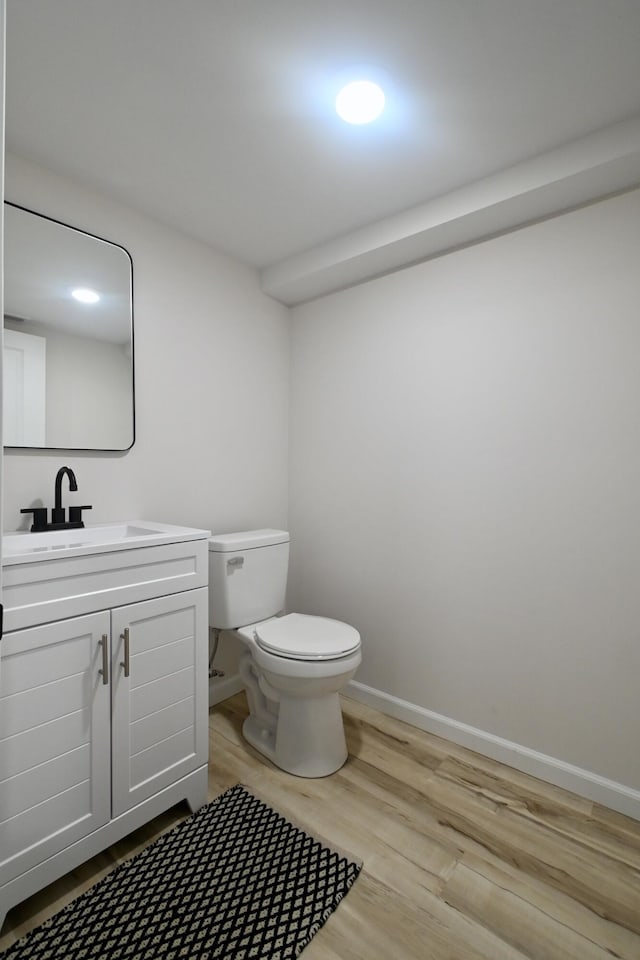 529 Stevenson Rd, Erlanger, KY 41018 - bathroom featuring toilet, wood finished floors, vanity, and baseboards