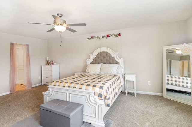bedroom featuring light carpet, baseboards, and ceiling fan