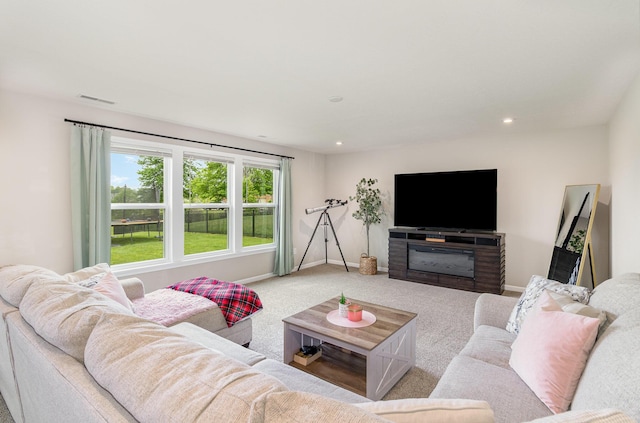 carpeted living room with baseboards and recessed lighting