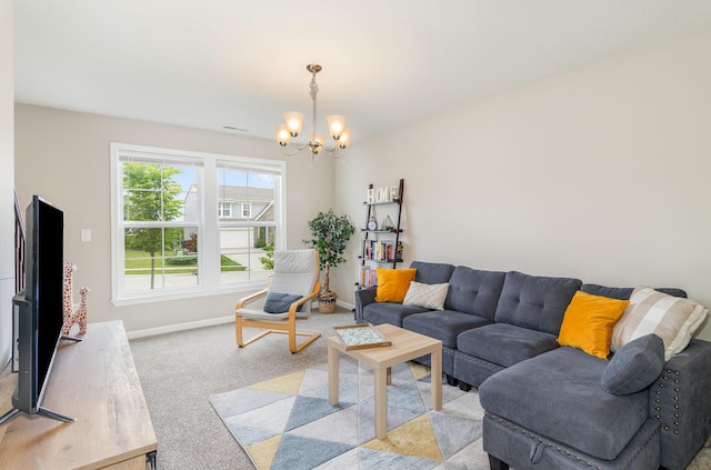 living area featuring a chandelier, light carpet, and baseboards