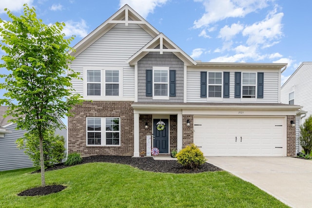 view of front of property featuring brick siding, driveway, a front yard, and an attached garage