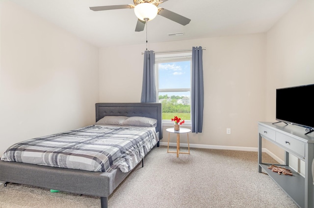 carpeted bedroom with baseboards and ceiling fan