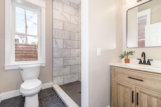1102 Lee St, Covington, KY 41011 - bathroom featuring baseboards, toilet, a stall shower, and vanity