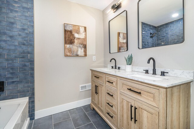 1102 Lee St, Covington, KY 41011 - bathroom featuring tile patterned flooring, baseboards, double vanity, a shower, and a bathtub
