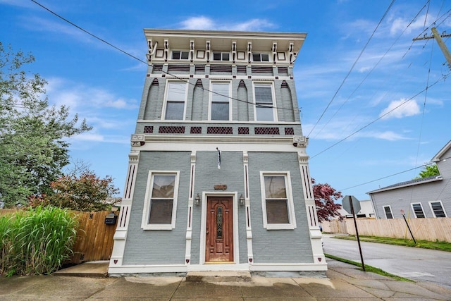 1228-1232 Russell St, Covington, KY 41011 - view of front of house with a balcony, fence, and brick siding