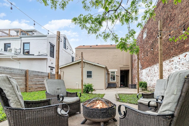 810 Saratoga St, Newport, KY 41071 - back of property with a fire pit, a patio, and fence
