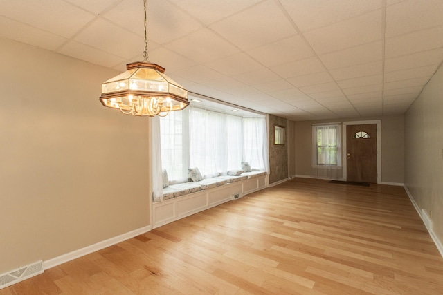1101 Mckinney Ave, Dayton, KY 41074 - unfurnished room featuring light wood-style floors, baseboards, and a chandelier