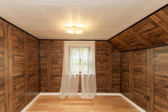1101 Mckinney Ave, Dayton, KY 41074 - bonus room featuring wood walls, light wood finished floors, and lofted ceiling