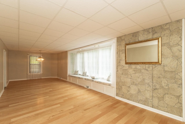 1101 Mckinney Ave, Dayton, KY 41074 - spare room with light wood-style flooring and a paneled ceiling
