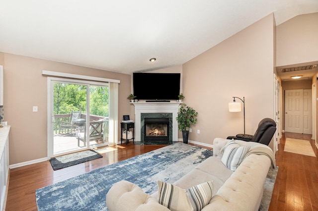 37 Pinhook Pl, Crittenden, KY 41030 - living area with lofted ceiling, wood finished floors, a premium fireplace, and baseboards