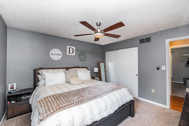 37 Pinhook Pl, Crittenden, KY 41030 - bedroom featuring a closet, baseboards, light colored carpet, ceiling fan, and a textured ceiling