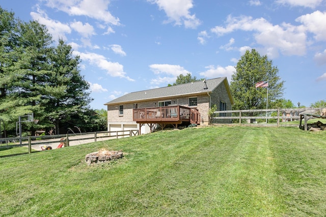 37 Pinhook Pl, Crittenden, KY 41030 - view of yard featuring a wooden deck, an attached garage, a fire pit, and concrete driveway