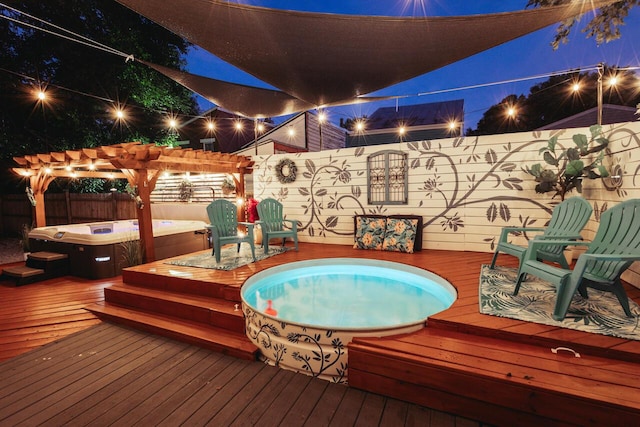 251 W 6th St, Covington, KY 41011 - deck at twilight with an outdoor hot tub, a fenced backyard, and a pergola