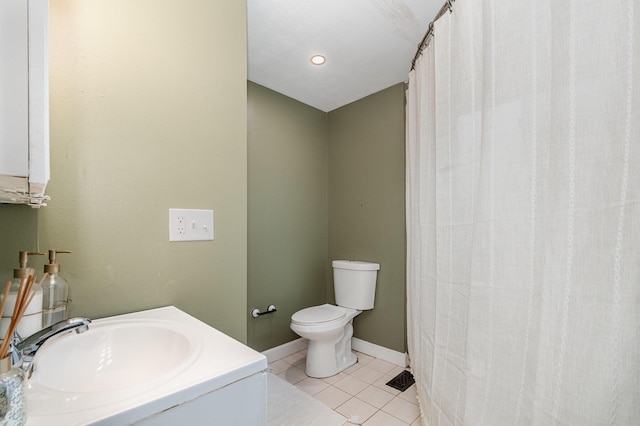 bathroom with tile patterned flooring, toilet, baseboards, and vanity
