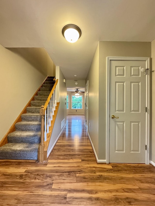 1317 Brook Ct, Erlanger, KY 41018 - hall with wood finished floors, stairway, and baseboards