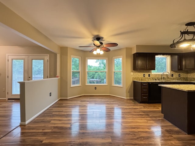 1317 Brook Ct, Erlanger, KY 41018 - kitchen featuring ceiling fan, dark wood-style flooring, decorative backsplash, and a sink