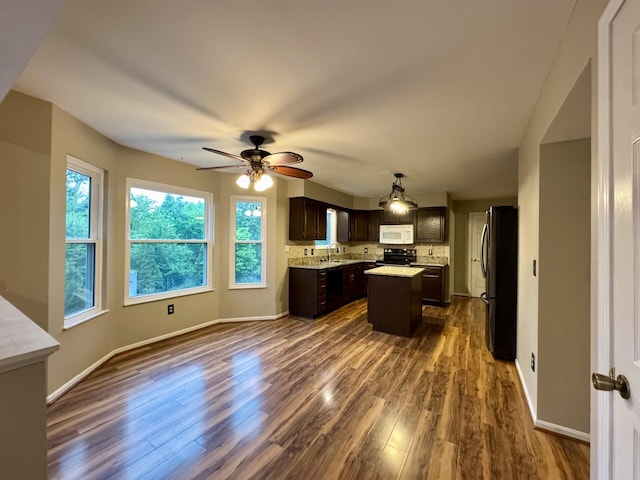 1317 Brook Ct, Erlanger, KY 41018 - kitchen with black appliances, a center island, dark brown cabinets, decorative backsplash, and dark wood-style flooring