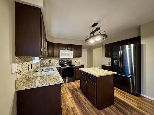 1317 Brook Ct, Erlanger, KY 41018 - kitchen with stainless steel electric range oven, fridge with ice dispenser, white microwave, a sink, and dark brown cabinets