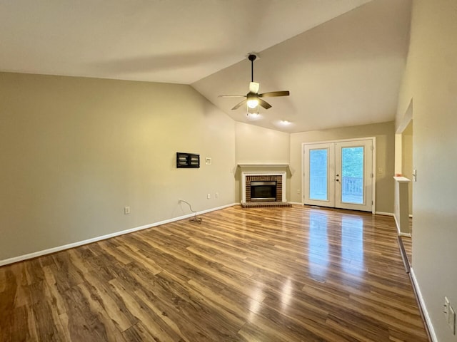 1317 Brook Ct, Erlanger, KY 41018 - unfurnished living room featuring ceiling fan, a brick fireplace, vaulted ceiling, dark wood finished floors, and baseboards