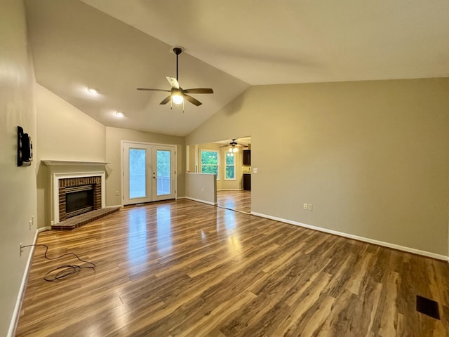 1317 Brook Ct, Erlanger, KY 41018 - unfurnished living room featuring a ceiling fan, french doors, a brick fireplace, baseboards, and high vaulted ceiling