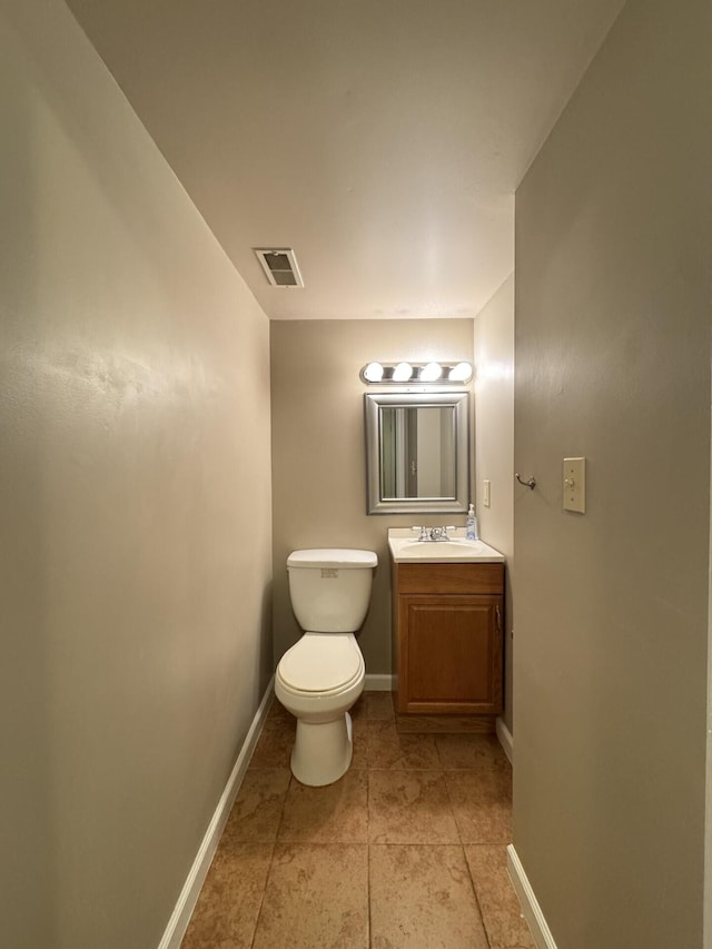 1317 Brook Ct, Erlanger, KY 41018 - half bathroom featuring toilet, vanity, tile patterned flooring, and baseboards